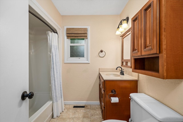 full bathroom featuring tile floors, vanity with extensive cabinet space, shower / tub combo with curtain, and toilet