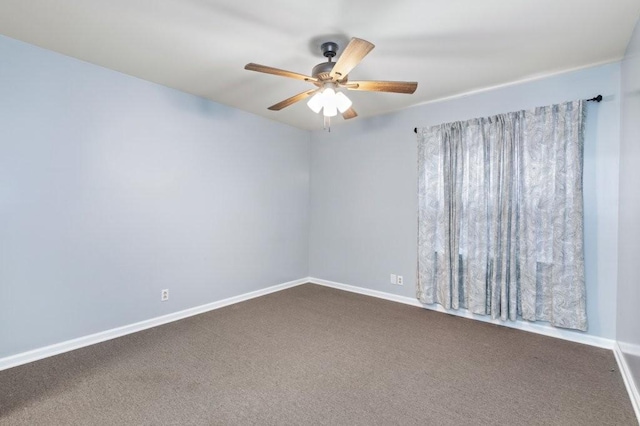 empty room with ceiling fan and carpet