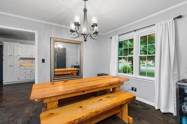 dining area with crown molding, dark hardwood / wood-style flooring, and a chandelier