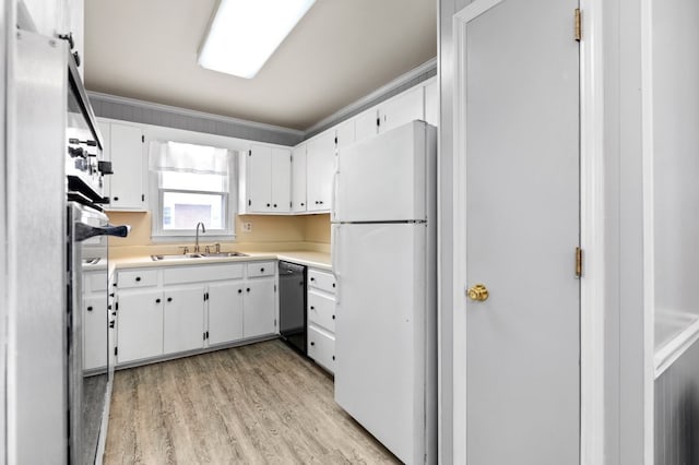 kitchen with sink, dishwashing machine, light hardwood / wood-style floors, white cabinetry, and white fridge