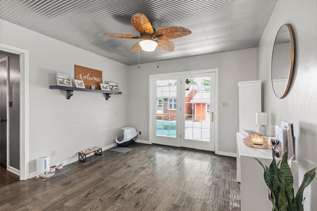 interior space with ceiling fan, french doors, and dark wood-type flooring