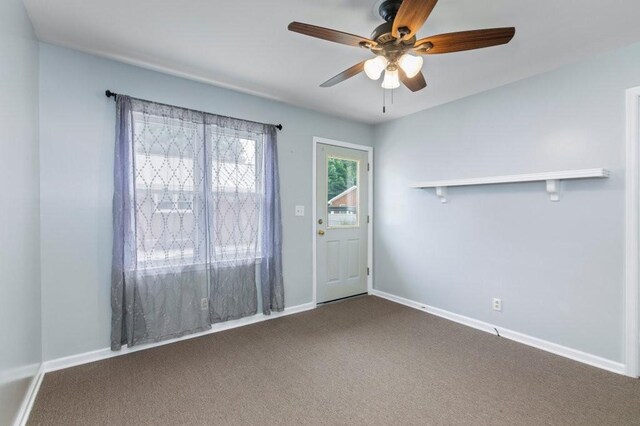 carpeted empty room with ceiling fan