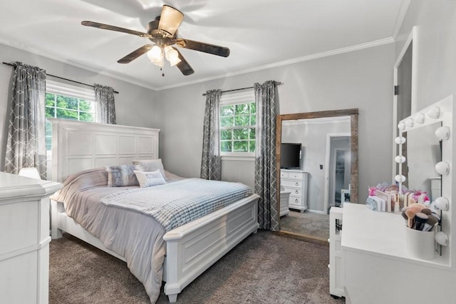 bedroom featuring multiple windows, crown molding, dark carpet, and ceiling fan