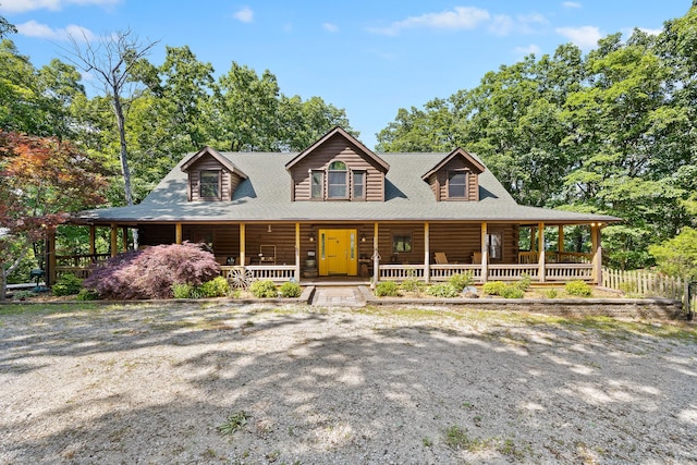 cabin featuring a porch