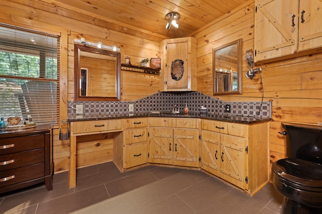 bathroom featuring wooden ceiling, wooden walls, and tile patterned flooring