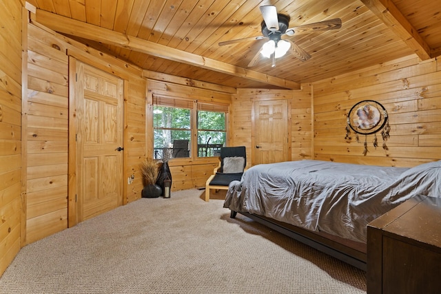 carpeted bedroom featuring wood ceiling, ceiling fan, wood walls, and beam ceiling