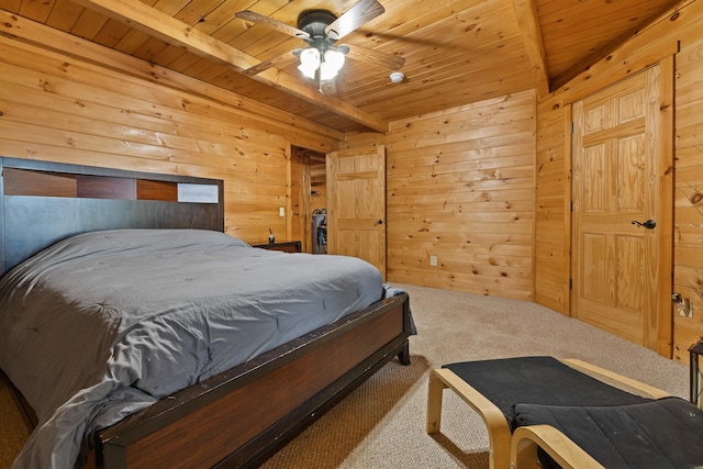 bedroom with beam ceiling, ceiling fan, wooden walls, and wooden ceiling