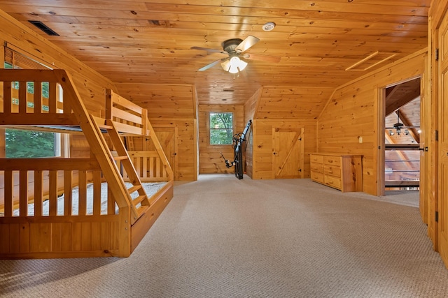 additional living space with carpet floors, wooden ceiling, ceiling fan, and vaulted ceiling