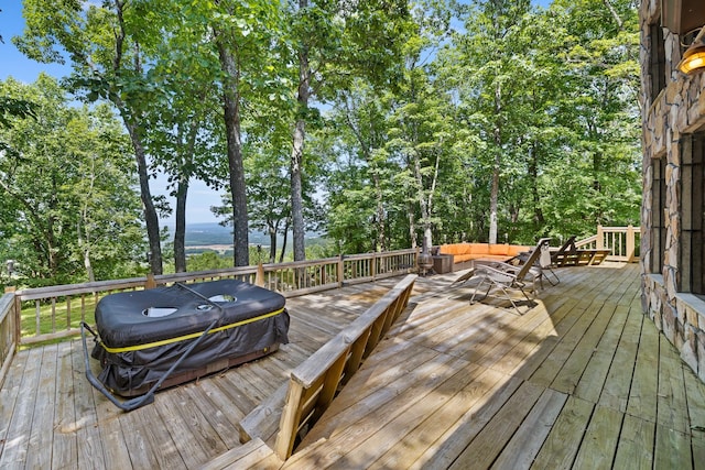 wooden deck featuring an outdoor hangout area