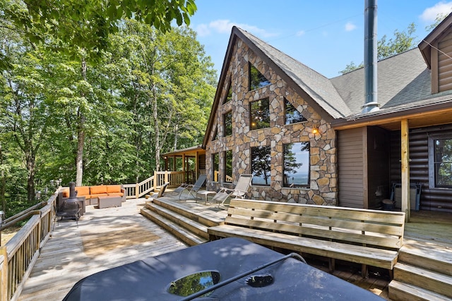 wooden deck featuring an outdoor hangout area