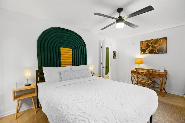 bedroom featuring ceiling fan and hardwood / wood-style floors