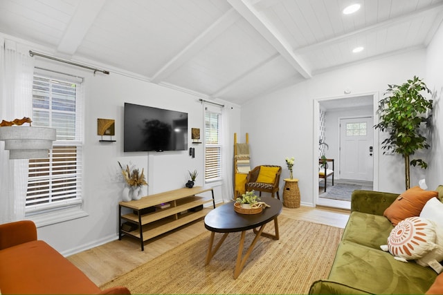 living room with wood ceiling, vaulted ceiling with beams, a healthy amount of sunlight, and light hardwood / wood-style floors