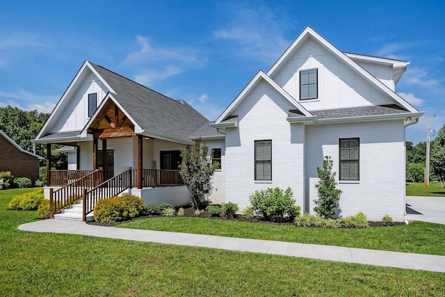 view of front of house with a front lawn and a porch