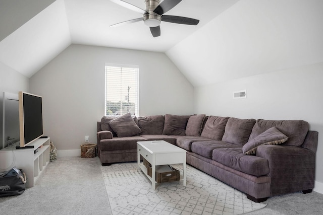 living room with ceiling fan, light colored carpet, and lofted ceiling