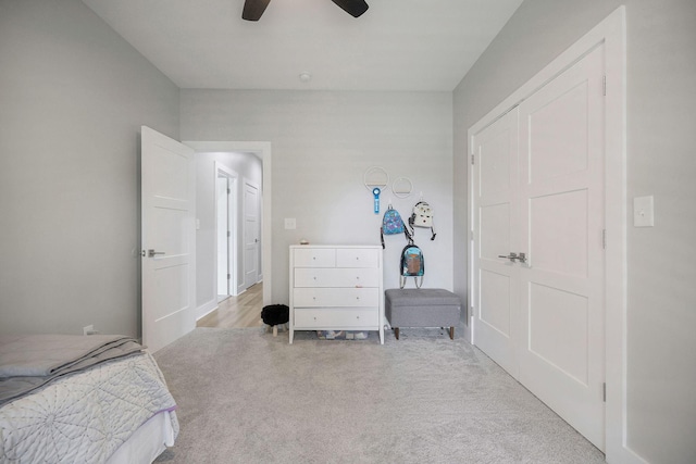 bedroom with light colored carpet and ceiling fan