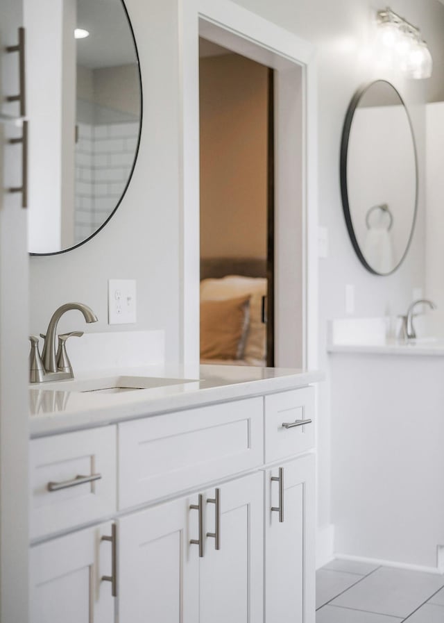 bathroom featuring tile patterned floors and vanity