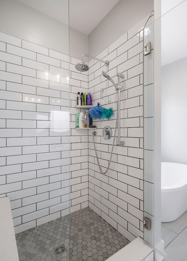 bathroom featuring a shower with shower door