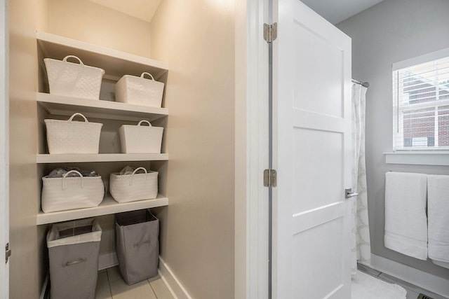 bathroom with tile patterned floors