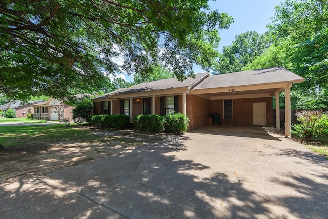 ranch-style home featuring a carport