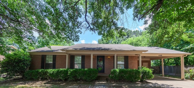 single story home featuring a carport