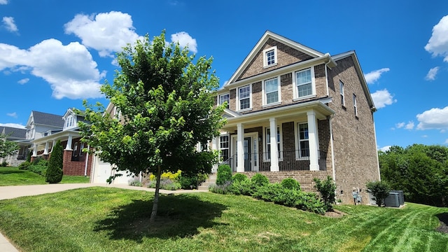 view of front of house featuring central air condition unit, a porch, and a front yard