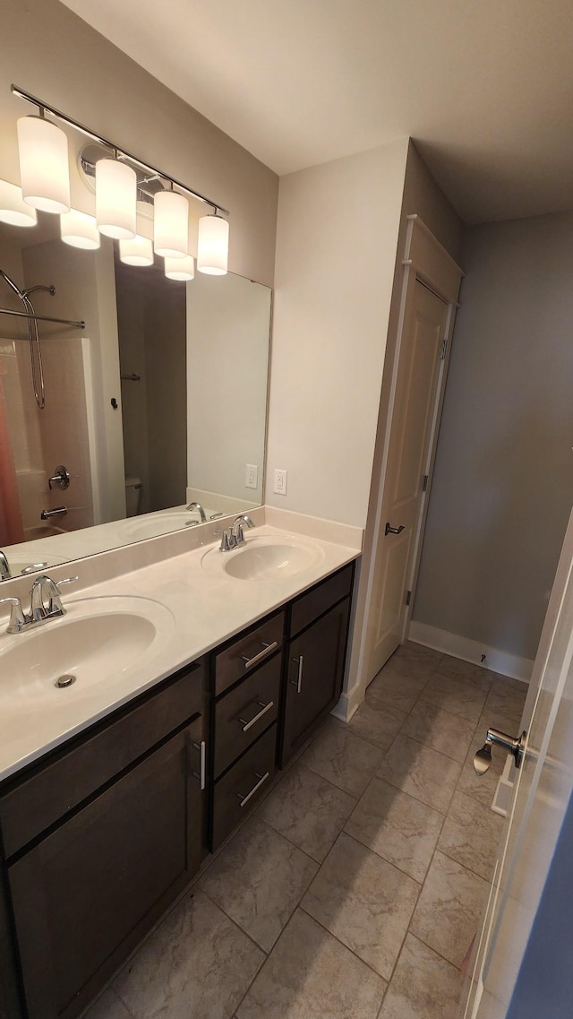 full bathroom with vanity, bathtub / shower combination, and toilet