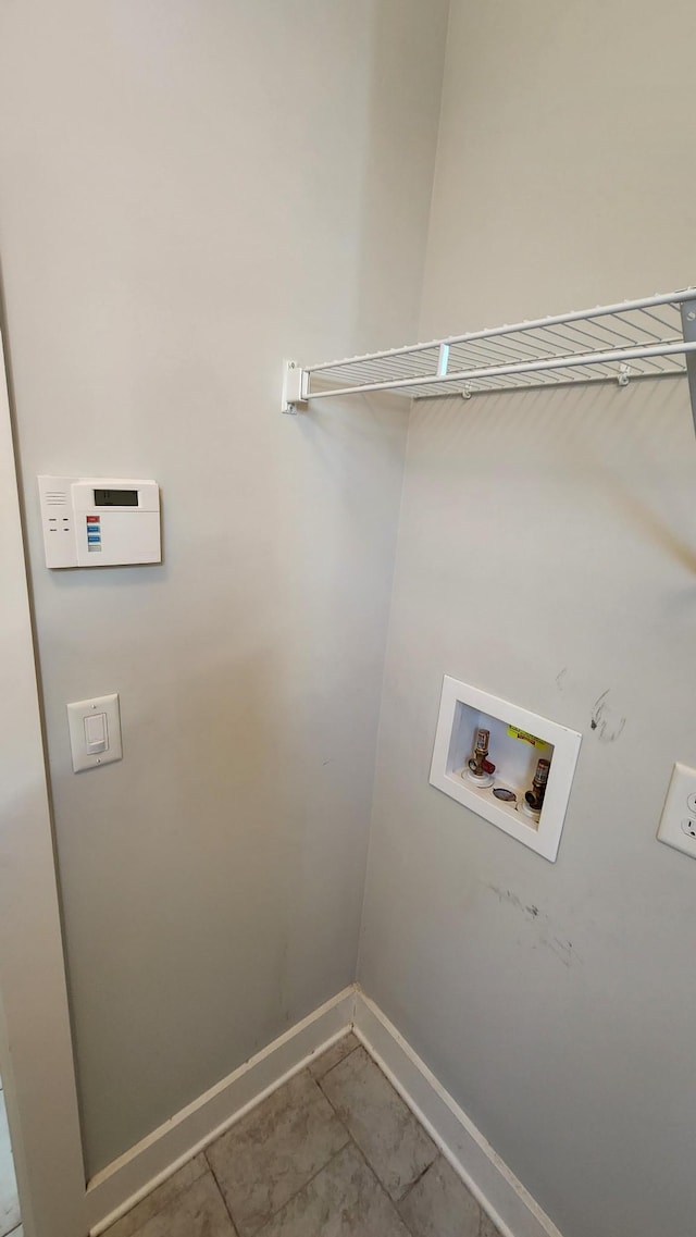 clothes washing area featuring washer hookup and tile patterned floors