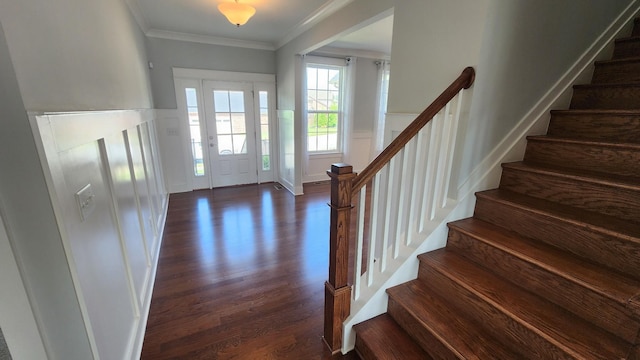 foyer with dark wood-type flooring and ornamental molding