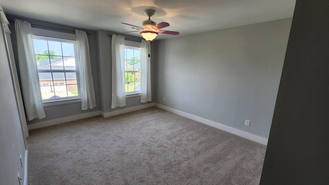 empty room with light carpet and ceiling fan