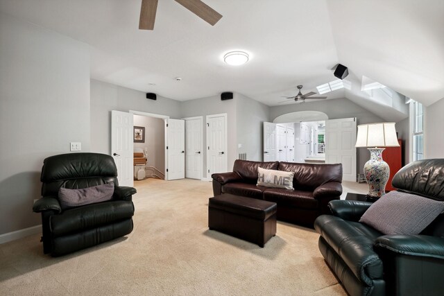 living room featuring light colored carpet and ceiling fan