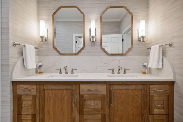 bathroom with tile walls, tasteful backsplash, double sink, and vanity with extensive cabinet space