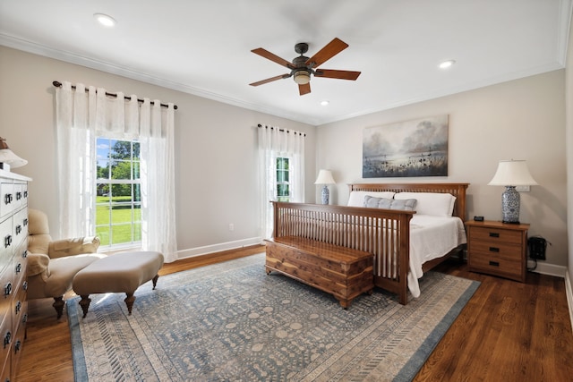 bedroom with ornamental molding, ceiling fan, and dark hardwood / wood-style flooring