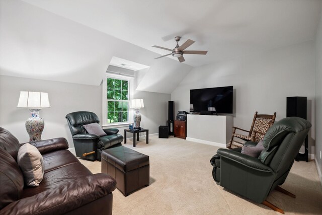 living room with carpet, ceiling fan, and vaulted ceiling