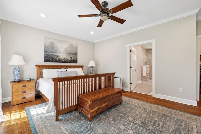 bedroom with ceiling fan, connected bathroom, ornamental molding, and wood-type flooring