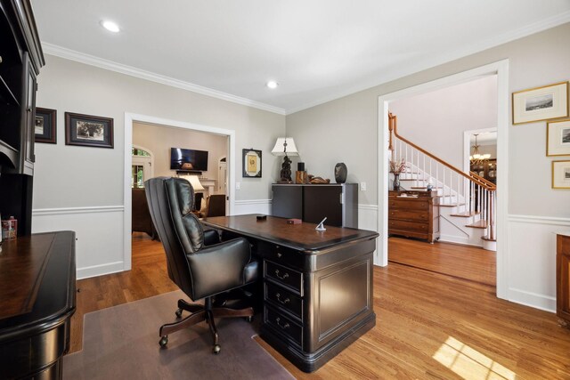 home office with ornamental molding, a chandelier, and light wood-type flooring