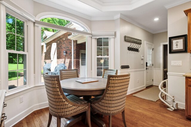 dining room featuring crown molding and wood-type flooring