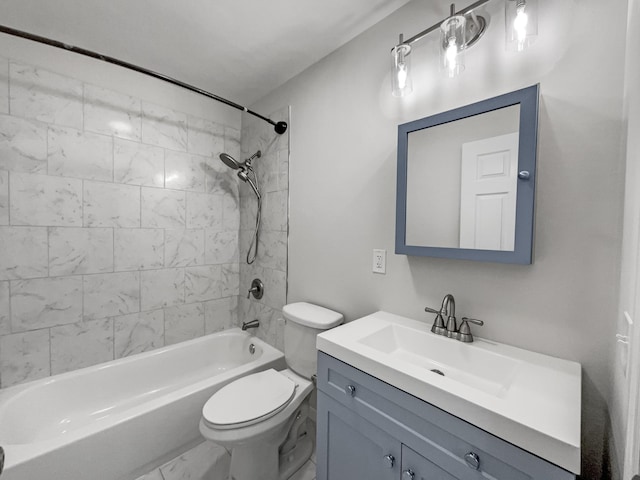 full bathroom featuring toilet, vanity, and tiled shower / bath