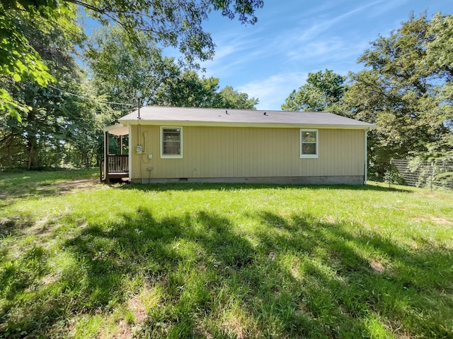 back of house with a yard