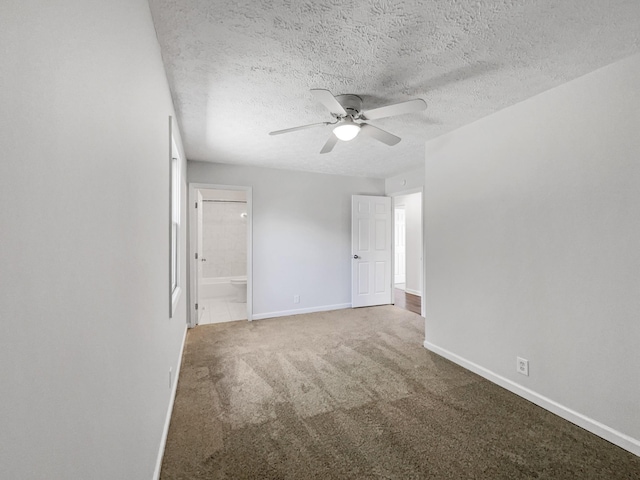 unfurnished room featuring ceiling fan, carpet floors, and a textured ceiling