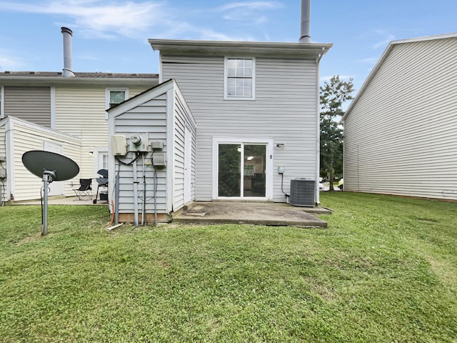 back of house with central AC unit, a patio, and a lawn