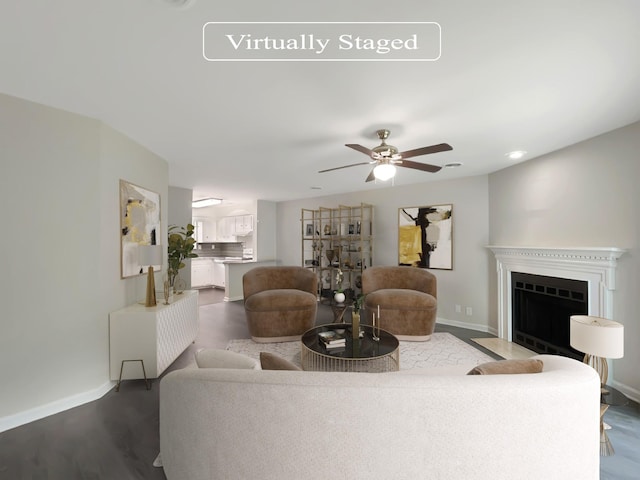 living room with dark hardwood / wood-style floors and ceiling fan