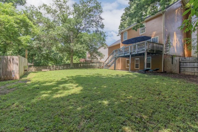 view of yard with a wooden deck