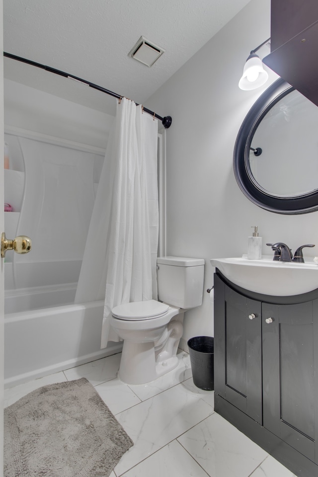 full bathroom featuring vanity, shower / tub combo, tile patterned floors, a textured ceiling, and toilet