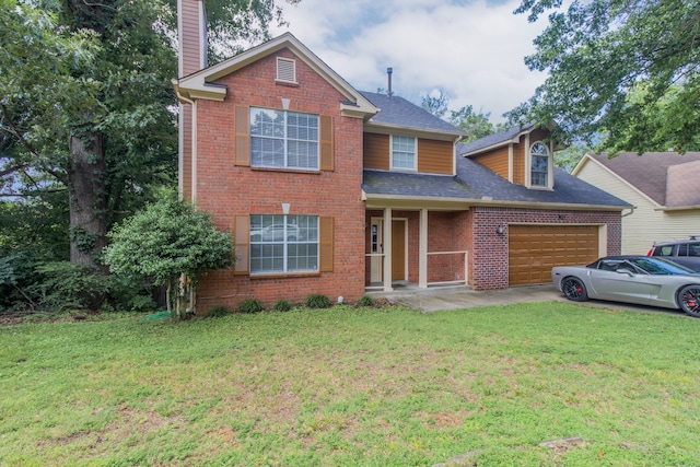 view of front of house featuring a front yard and a garage