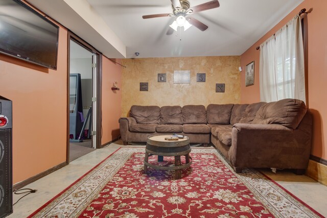 living room featuring ceiling fan and light colored carpet