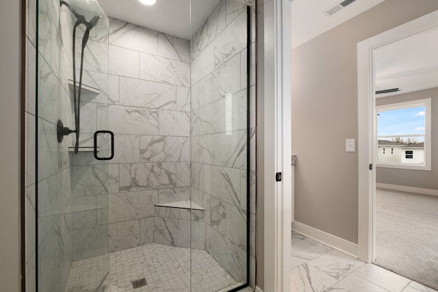 bathroom with an enclosed shower and tile floors