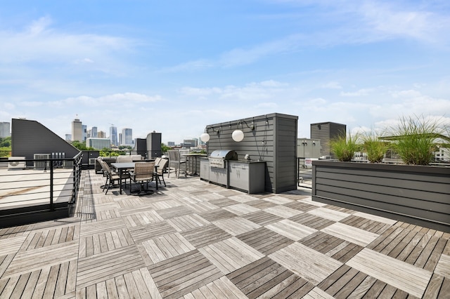 wooden terrace featuring grilling area