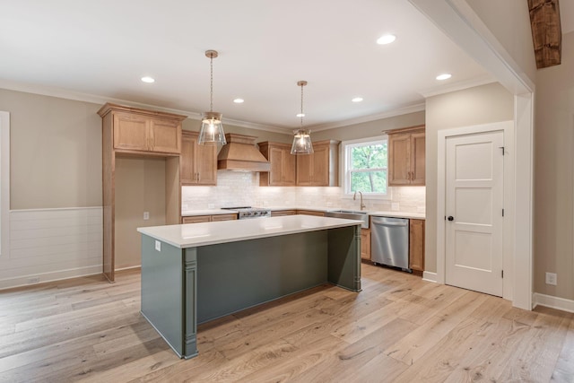 kitchen featuring a kitchen island, dishwasher, hanging light fixtures, custom range hood, and light hardwood / wood-style flooring