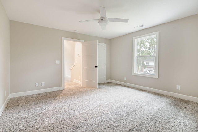 unfurnished bedroom with ceiling fan and carpet