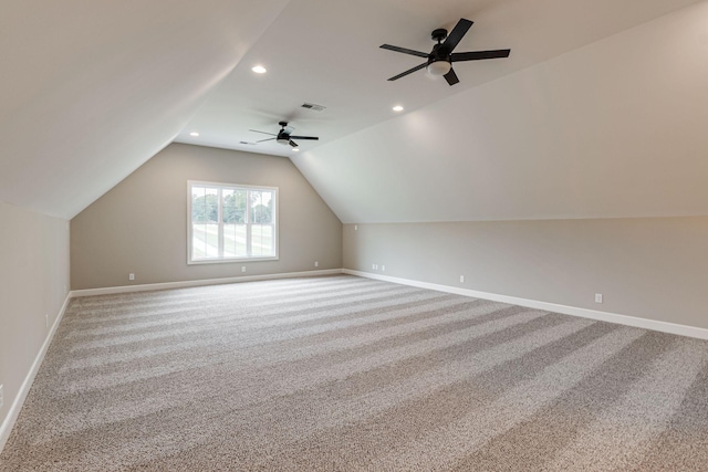 bonus room with lofted ceiling and carpet flooring